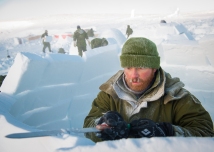 CX02-2016-0042-103 16 February, 2016 Crystal City (Resolute Bay), Nunavut. Corporal Calvin Slute, student of Canadian Forces School of Search and Rescue Course 49, edges with the right angle the wall of his igloo during the Arctic Survival Phase in Crystal City, Nunavut, on 16 February, 2016. Image by Corporal Létourneau PJJ 19 Wing Imaging © 2016, DND-MDN Canada